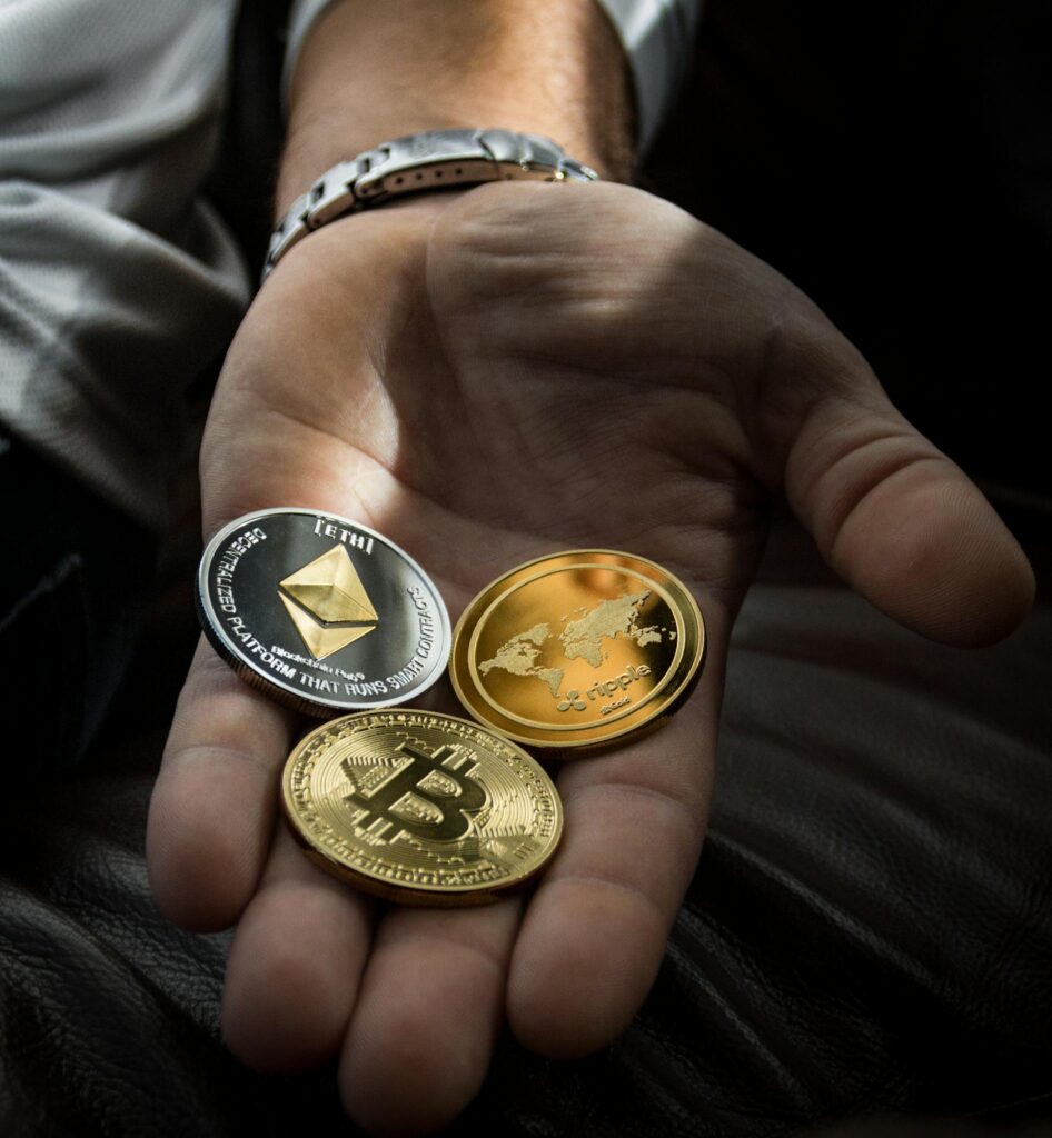 Closeup Photo of Three Round Coins in Person's Palm